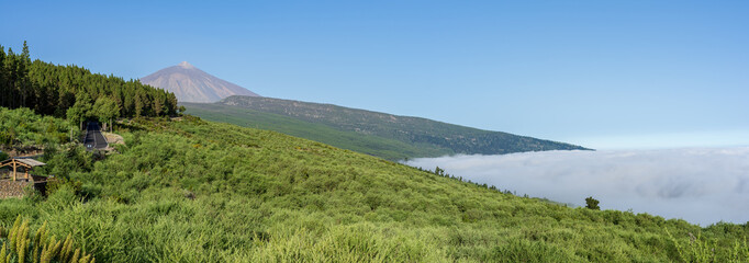 Panoramic view of the morning mountain valley. Volcano Teide in the background. Tenerife. Canary Islands. Spain. View from the viewpoint - "Mirador de La Bermeja".