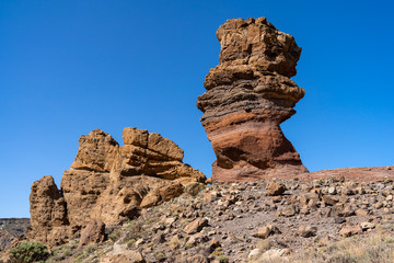 Fototapeta premium The lava fields of Las Canadas caldera of Teide volcano and rock formations - Roques de Garcia. Tenerife. Canary Islands. Spain.
