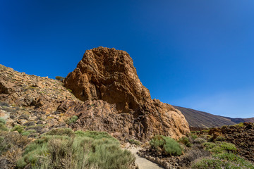 Fototapeta na wymiar The lava fields of Las Canadas caldera of Teide volcano and rock formations - Roques de Garcia. Tenerife. Canary Islands. Spain.