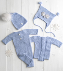 Blue knitted clothes for babies