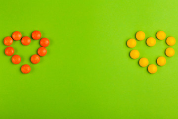 Coated glaze chocolate little candies shaped into two hearts