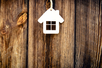 House symbol on a background of pine boards 