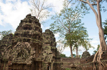 Fototapeta premium Ta Prohm , Angkor , Cambodia, was inscribed on the UNESCO-WHL 1992. The ancient temple where roots of the jungle trees intertwine with the masonry of these ancient structures producing surreal world.
