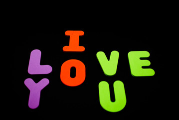 Foam English aphabet letters. I love you with bright letters. Saint Valentine 14 February Concept.
