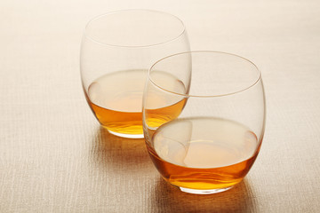 Two glasses with whiskey without ice cubes