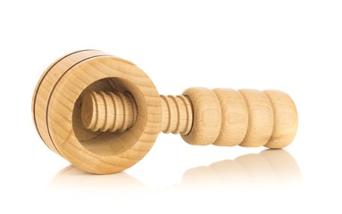 A wooden screw type nutcracker on a white background