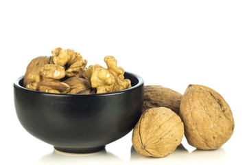 A bowl of walnuts on a white background with copy space for your text