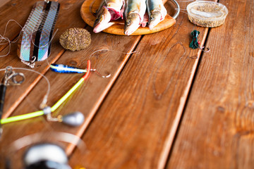 The catch of fresh sea fish lies on a cutting Board on a wooden table in the kitchen Selective...