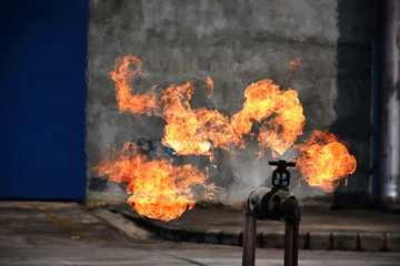 Gas pipeline leaks at the joints with the valve. Spark and Fire on the gas pipeline. An explosion at the gas pipeline.