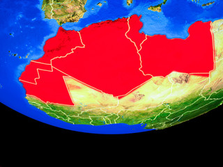 Maghreb region from space on model of planet Earth with country borders.