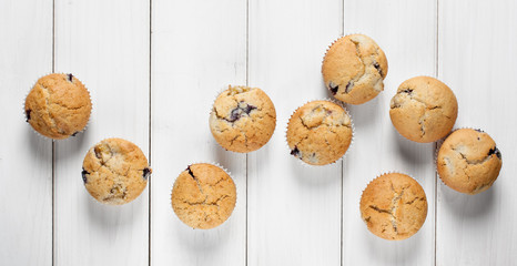 Homemade blueberry muffins on a wooden background