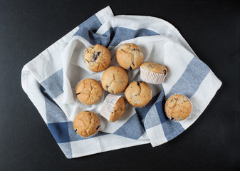 Homemade tradition muffins on dark background. Top view