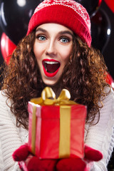 Portrait of fashionable woman showing banner of winter sale. isolated on white background