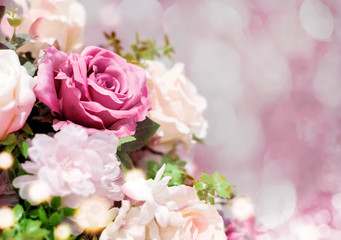 Obraz na płótnie Canvas Valentine's day decoration of roses on pink bokeh background