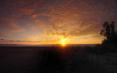 Sunset on the big river. Panorama. Summer, Russia, Ural, Perm Region