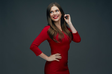 Fototapeta premium portrait of smiling woman in red dress