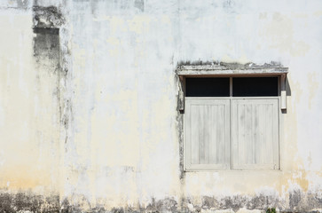 white simple vintage window with awning on grunge cement wall background, copy space