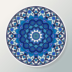 Decorative plate with round ornament in ethnic style. Mandala in blue colors. Oriental pattern. Vector illustration.