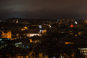 Naklejka premium Night view of Vilnius city. Panorma. Snow. Winter. Christmas.