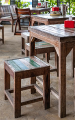 Wooden chairs and table in the restaurant.