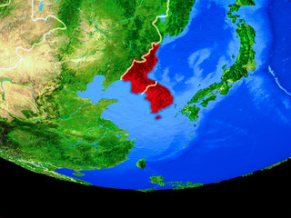 Korea from space on model of planet Earth with country borders.