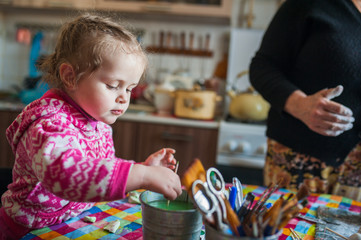 Cute baby sculpts on the table of dough