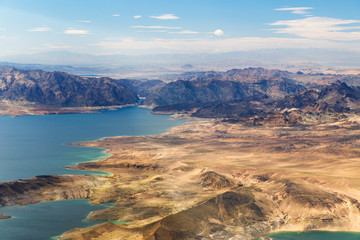 landscape and nature concept - aerial view of grand canyon and lake mead from helicopter