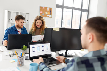 business, technology and people concept - creative team or designers working on user interface at office