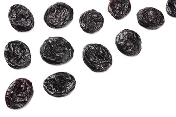 Dried plums - prunes isolated on white background. top view