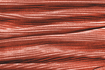 Coral colored fabric texture. Concept of color of 2019.