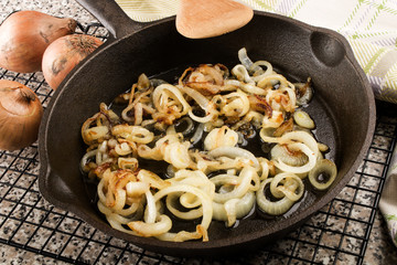 roasted onions in a cast iron pan