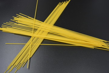 Long dry vermicelli, Italian pasta spaghetti from hard wheat varieties in packs on an interesting...