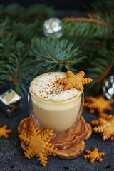 Gingerbread snowflake cookie, a cup of cappuccino for christmas.
