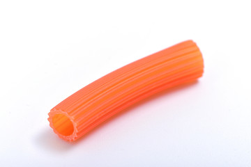 Pasta red macaroni on white