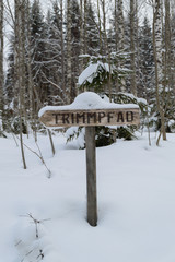 Snow covered sign of keep-fit trail