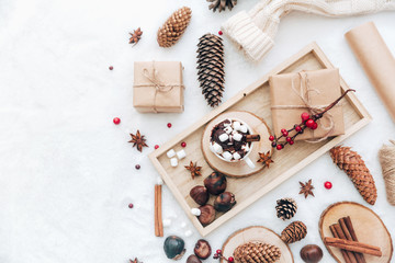 Flat lay hot cocoa with marshmallow and warm scarf, blogger concept. Christmas holiday winter background