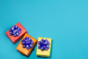 Fototapeta na wymiar Colored gifts on a blue background