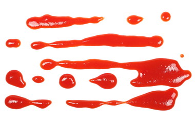 red ketchup splashes isolated on white background, tomato pure texture, top view
