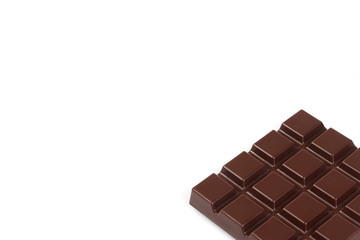 Dark chocolate bar isolated on a white background.