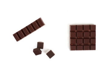 Set with different kinds of chocolate on white background.