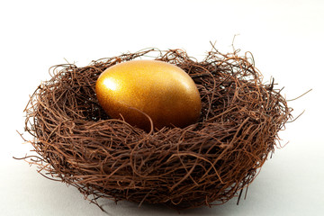 Individual retirement account, personal savings and pension fund concept with close up on a golden...