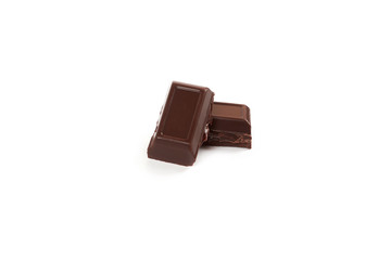 Close-up pieces of chocolate bar with filling isolated on white background.