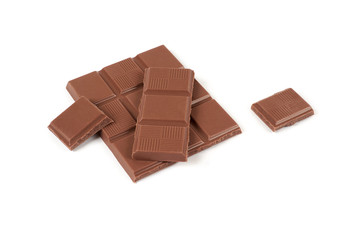 pieces of milk chocolate bar isolated on white background.
