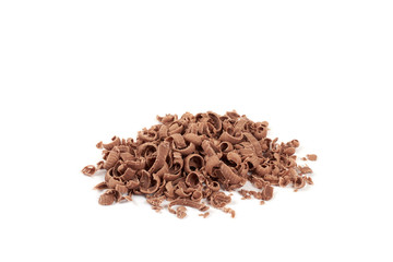 Grated chocolate in a pile isolated on white background.