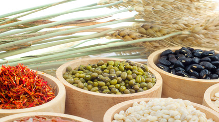 Cereal grains , seeds, beans on wooden background