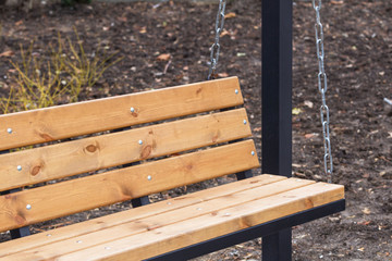 Naklejka premium swing on chains in the Park