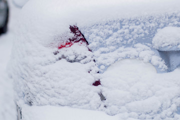 Fototapeta na wymiar car headlight in the snow in winter