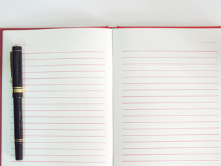 empty paper notebook background with pen