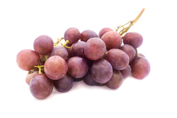 Bunch of purple large grapes on a white background