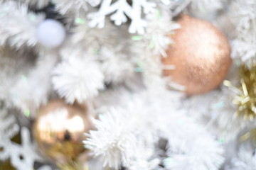 Naklejka na ściany i meble Merry christmas and happy new year Closeup of Christmas-tree and gold balls,white balls, tree branches on abstract background